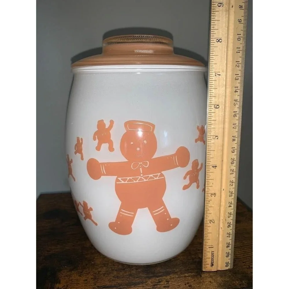 Vintage Bartlett Collins milk glass cookie jar featuring gingerbread man design